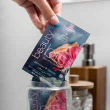 Load image into Gallery viewer, Organic spirulina tablets by BEAUTYbits shown in eco-friendly travel packs for plant-based nutrition.